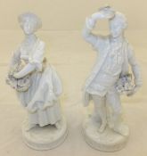 A pair of Dresden blanc-de-chine figures of a gallant with hat full of flowers and woman with