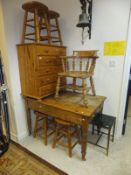 A pine farmhouse kitchen table, a smoker's bow chair, a modern pine chest of five drawers,