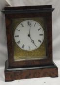 A burr cedar cased mantel clock with mechanism marked to back "VAP Brevete S.G.D.G" CONDITION