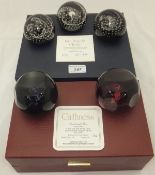 A cased set of three Caithness glass paperweights - "Faith", "Hope" and "Charity", No'd. 196/250, in