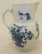 An 18th Century Caughley cabbage leaf jug, transfer printed in underglaze blue with floral sprays