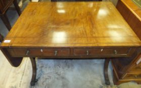 A 19th Century mahogany sofa table, the drop leaf top with rosewood banded decoration, over two