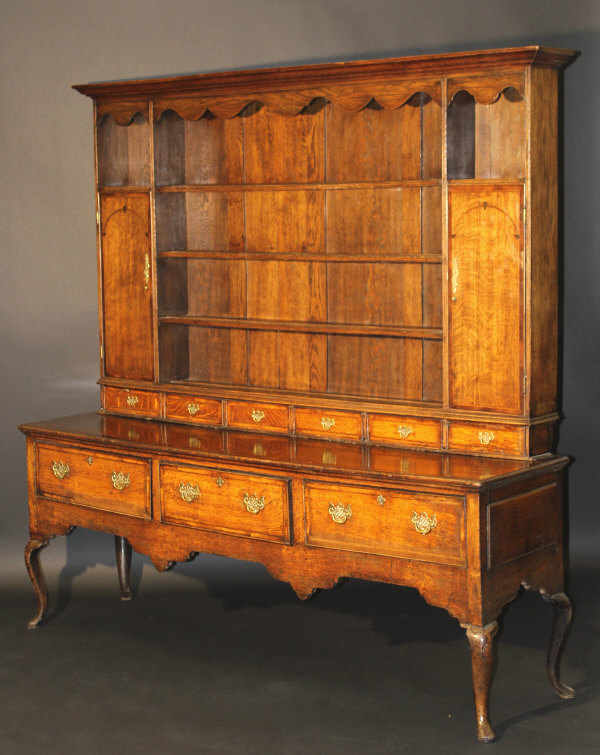 A George III Shropshire oak and cross-banded dresser with parquetry banded decoration,