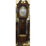 A 19th Century oak cased long case clock with later musical movement and brassed arched dial, with