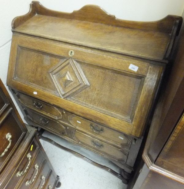 An early 20th Century oak bureau in the Jacobean manner