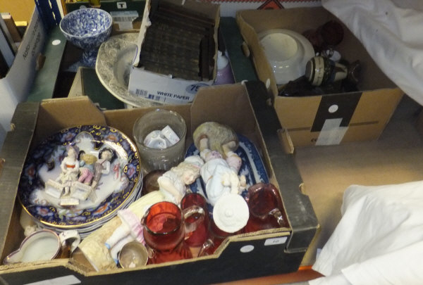 Three boxes of assorted decorative china and glasswares to include figurines, cranberry jugs, etc.