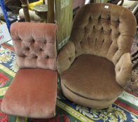 A Victorian armchair in dark salmon ground upholstery, on turned front legs,