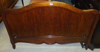 A 20th Century mahogany framed bedstead in the Louis XV taste