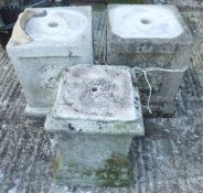 Three composite stone garden plinths