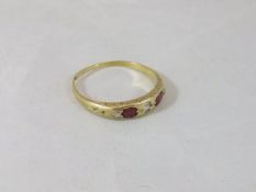 A ruby and diamond set 18 carat gold dress ring