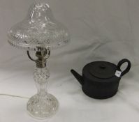 A 19th Century black basalt ware oval teapot in the Regency Wedgwood style, bears indistinct mark "