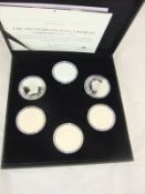 A boxed set of six sterling silver crowns "The 300 Years of King Georges Commemorative Set"