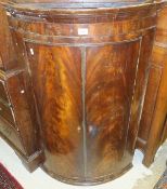 A 19th Century mahogany bow fronted corner cupboard,