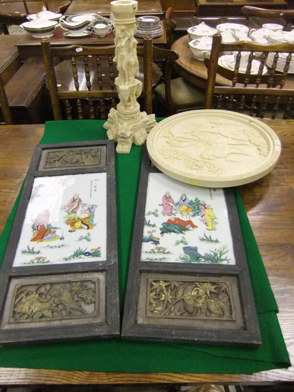 A pair of 20th Century Chinese plaques with printed design,
