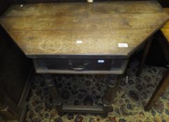 An 18th Century style oak credence table with single drawer,