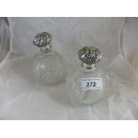 A pair of Victorian silver mounted cut glass grenade scent bottles (Chester 1894)