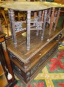 A Victorian carved oak monk's settle and two Benares brass topped folding coffee tables