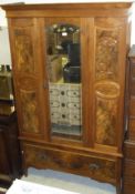 An art nouveau walnut wardrobe,