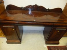 A late Regency/William IV mahogany pedestal sideboard,