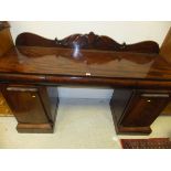 A late Regency/William IV mahogany pedestal sideboard,