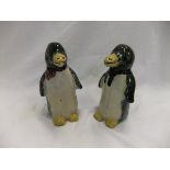 Two pottery figures of penguins (possibly Oriental) with green and yellow glazes,