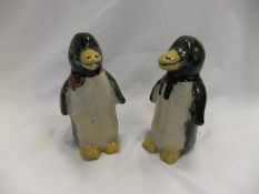 Two pottery figures of penguins (possibly Oriental) with green and yellow glazes,