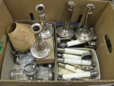 A box containing a pair of Morton's Patent Sheffield plated telescopic candlesticks,