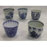 A collection of 19th Century and later blue and white cups, to include three Chinese examples,