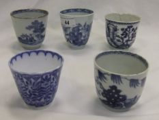 A collection of 19th Century and later blue and white cups, to include three Chinese examples,