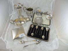A collection of silver ware to include a George V silver sauce boat (Sheffield 1934),