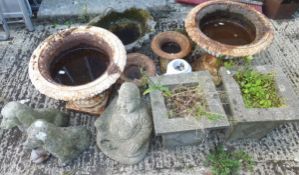 A pair of Victorian cast iron planters, two bird baths, two further planters, two dog ornaments,