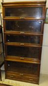 An early 20th Century Globe Wernicke five section bookcase with single drawer base