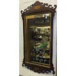 A circa 1900 mahogany and inlaid and fretwork carved wall mirror in the early 18th Century manner