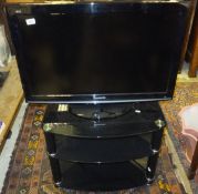 A Panasonic Viera television on stand and a cut glass bowl, etc CONDITION REPORTS TV: Size of screen