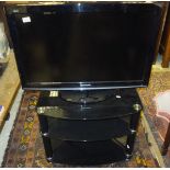 A Panasonic Viera television on stand and a cut glass bowl, etc CONDITION REPORTS TV: Size of screen