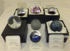 A collection of seven Caithness glass paperweights - "Ice Blossom", No'd. 279/1000, "Comet", No'd.