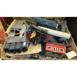 A box containing various '00' gauge toy trains including various locomotives, rolling stock,