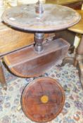 A late 19th Century mahogany and inlaid three tier circular dumb waiter on ringed and turned