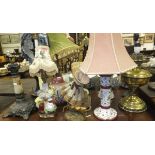 A large collection of various table lamp bases,