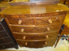 A Victorian mahogany bow fronted chest of two short and three long graduated drawers over a shaped