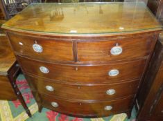 A Regency mahogany bow fronted chest of two short and three long graduated drawers on splayed