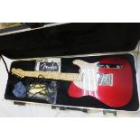 A Fender American Standard Telecaster Candy Cola electric guitar with pearl scratch plate,