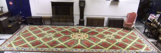 A large wool carpet in the 18th Century French taste by Stockwell Carpets, the centre field with