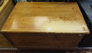 A stained pine blanket box / coffer to plinth base and castors