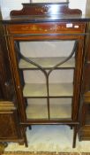 An Edwardian mahogany inlaid and painted single door display cabinet,