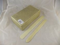 A shagreen cigarette box (faded), together with two circa 1900 ivory paper knives,