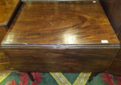 A mahogany Pembroke table on turned legs to brass castors