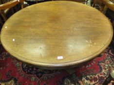 A 19th Century mahogany circular breakfast table with central pedestal and shaped base to claw feet