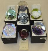 A collection of seven Selkirk Glass paperweights - "Rose", No'd. 146/450, "Sangrila", No'd.