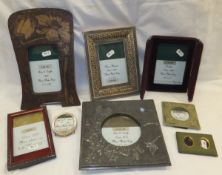 A Liberty style beaten photograph frame and a selection of various other photograph frames